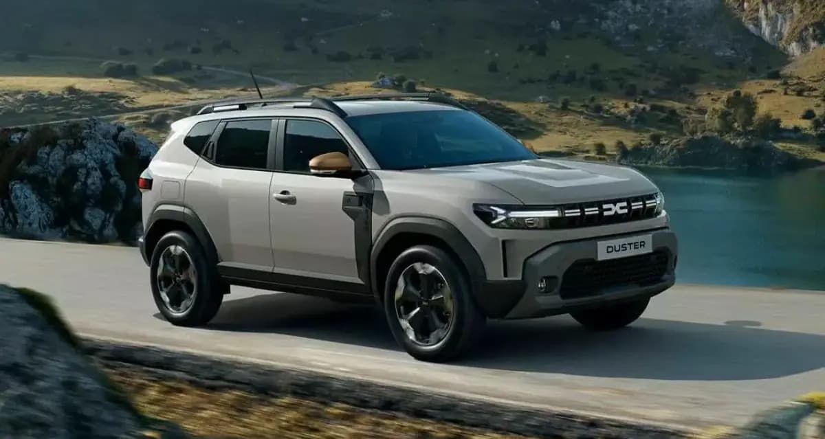 Grey/ Silver Renault Duster EV posing near lakeside